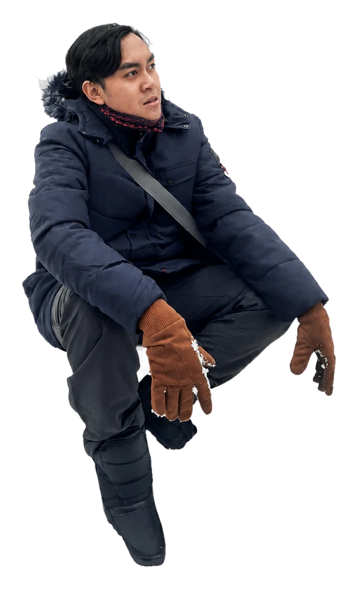 Mufli Agnal Noorshodiq wearing a navy winter jacket
